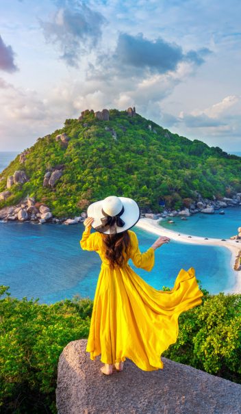 Beautiful girl standing on viewpoint at Koh Nangyuan island near Koh Tao island, Surat Thani in Thailand.